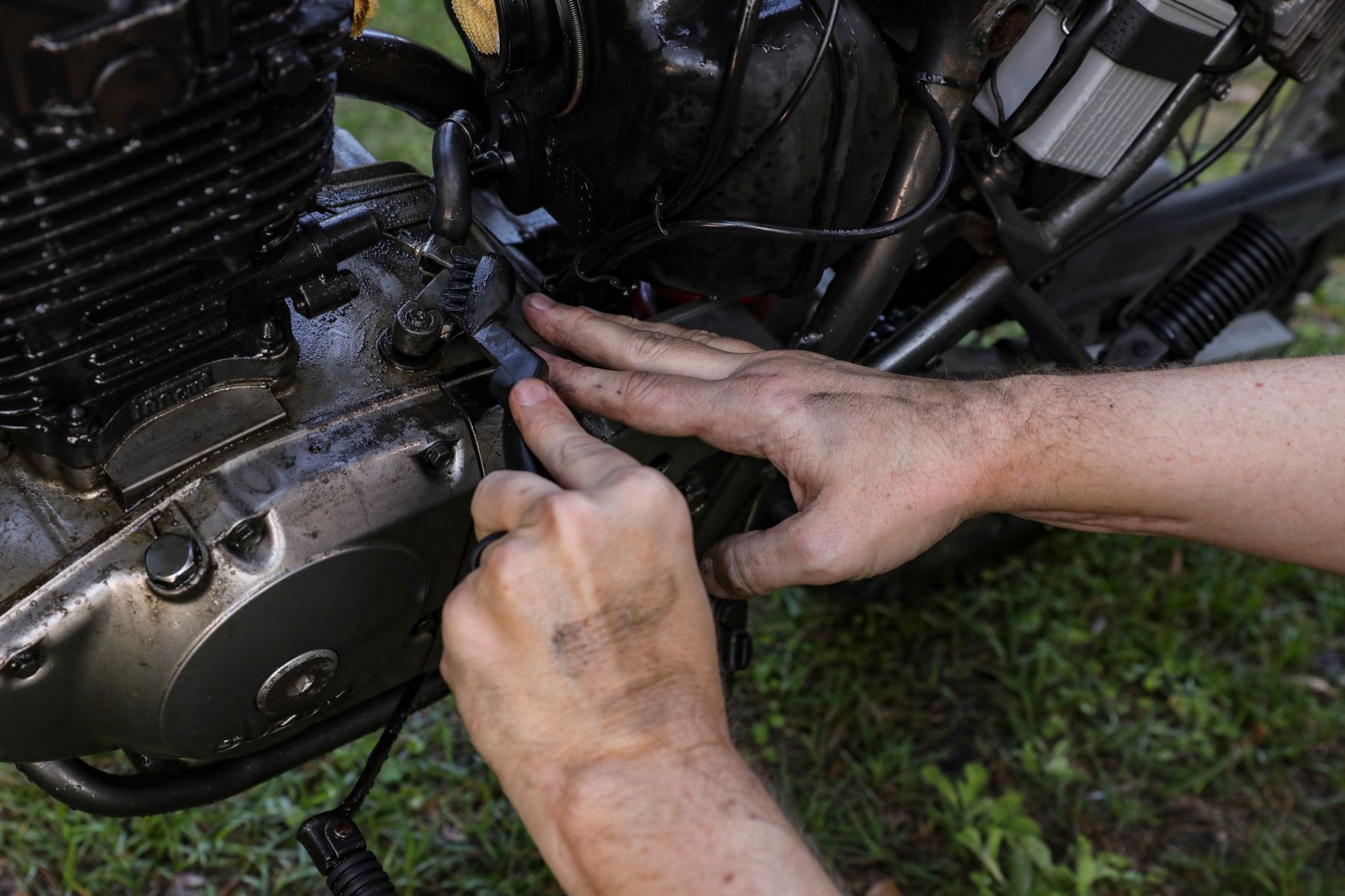 Vintage motorcycle before restoration, showing decades of patina