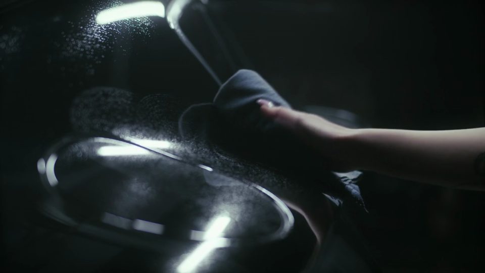 Hand polishing chrome on a motorcycle tank